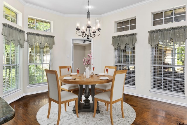 dining room featuring wood-type flooring, ornamental molding, and a chandelier