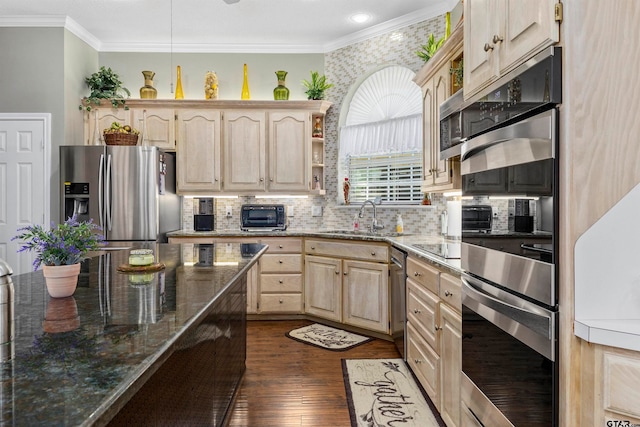 kitchen featuring dark wood-type flooring, light brown cabinets, sink, and stainless steel appliances