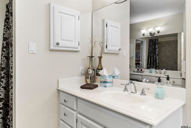 bathroom with vanity and a textured ceiling