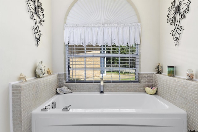 bathroom featuring a tub to relax in