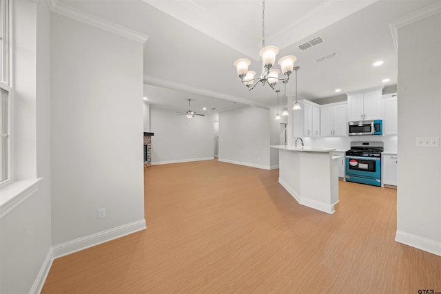 113 Hay Mdw, Winona, TX 75792 - kitchen with appliances with stainless steel finishes, ceiling fan, a chandelier, open floor plan, and light countertops