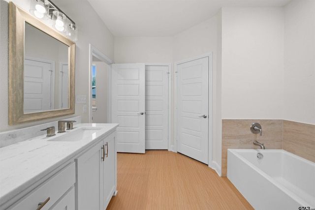 113 Hay Mdw, Winona, TX 75792 - bathroom featuring vanity, wood finished floors, and a bath