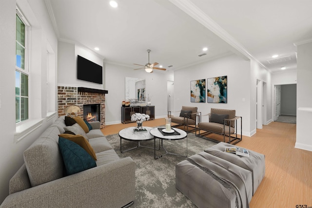 113 Hay Mdw, Winona, TX 75792 - living room with ornamental molding, wood finished floors, recessed lighting, a fireplace, and a ceiling fan