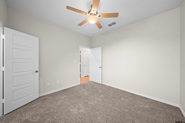113 Hay Mdw, Winona, TX 75792 - unfurnished bedroom featuring carpet flooring, baseboards, and ceiling fan