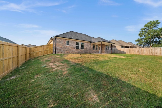113 Hay Mdw, Winona, TX 75792 - rear view of house with brick siding and roof with shingles