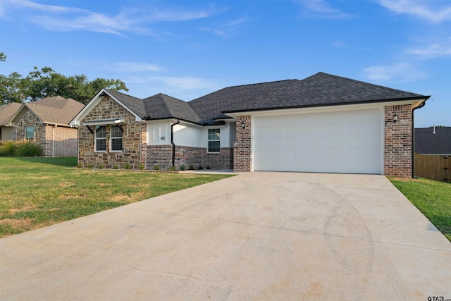 113 Hay Mdw, Winona, TX 75792 - view of front facade featuring driveway, a garage, brick siding, stone siding, and roof with shingles