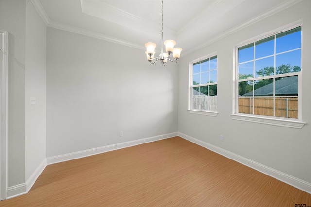 113 Hay Mdw, Winona, TX 75792 - unfurnished room with wood finished floors, crown molding, a chandelier, a raised ceiling, and baseboards