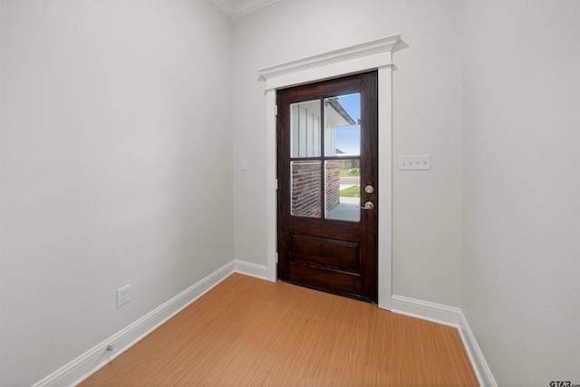 113 Hay Mdw, Winona, TX 75792 - entryway featuring baseboards, light wood finished floors, and ornamental molding