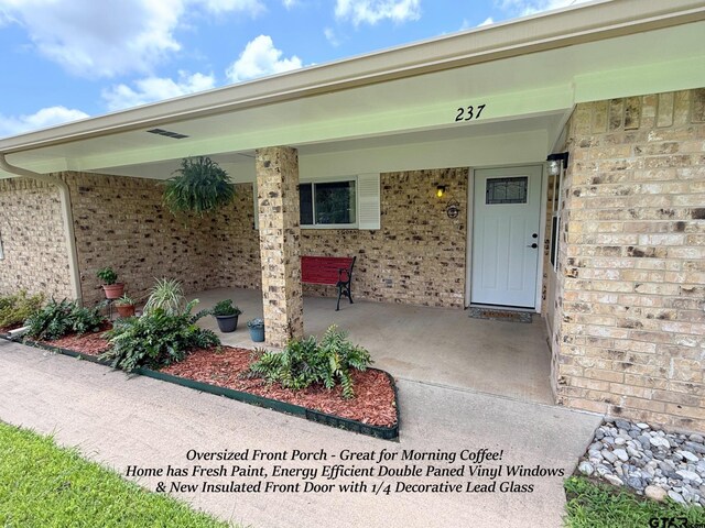 237 Oregon St, Van, TX 75790 - view of exterior entry featuring brick siding
