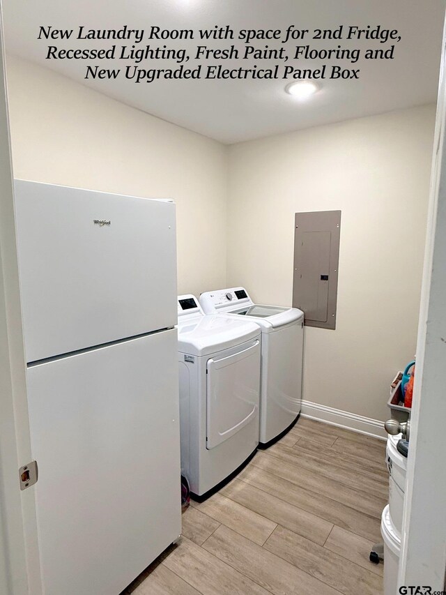 237 Oregon St, Van, TX 75790 - washroom featuring electric panel, independent washer and dryer, and light wood-style floors