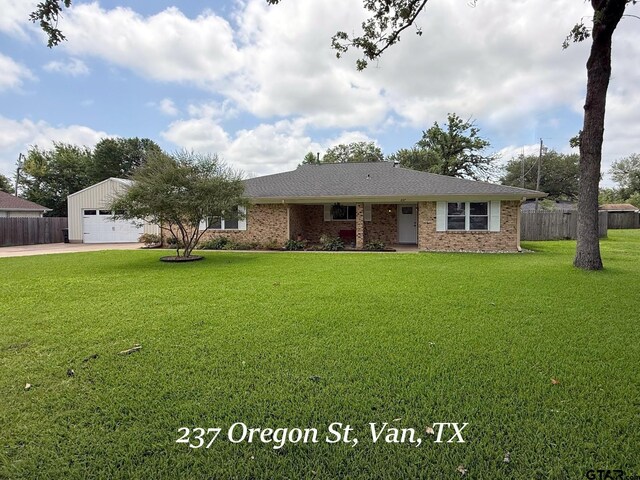 237 Oregon St, Van, TX 75790 - single story home featuring a garage, brick siding, and concrete driveway