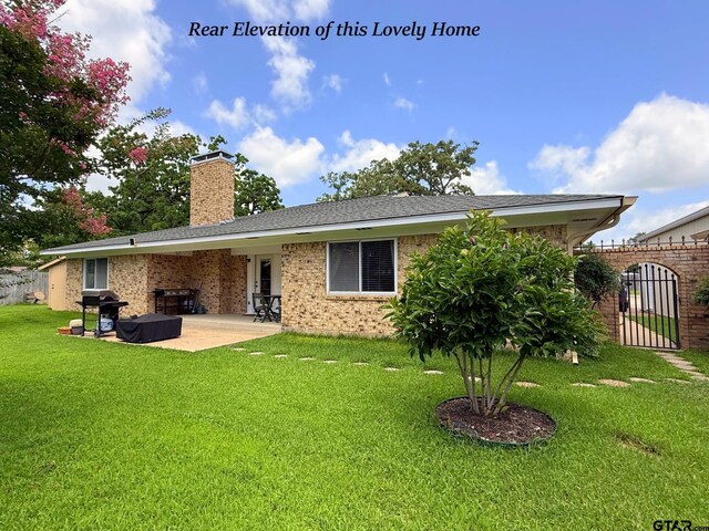 237 Oregon St, Van, TX 75790 - rear view of property featuring a patio area, a chimney, and brick siding