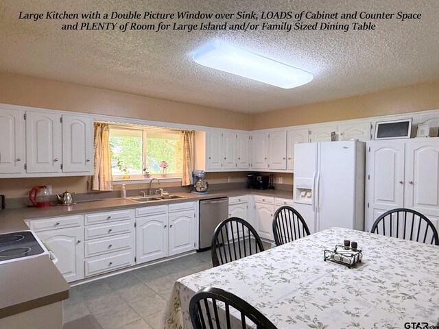 237 Oregon St, Van, TX 75790 - kitchen featuring white fridge with ice dispenser, dishwasher, white cabinetry, and a textured ceiling