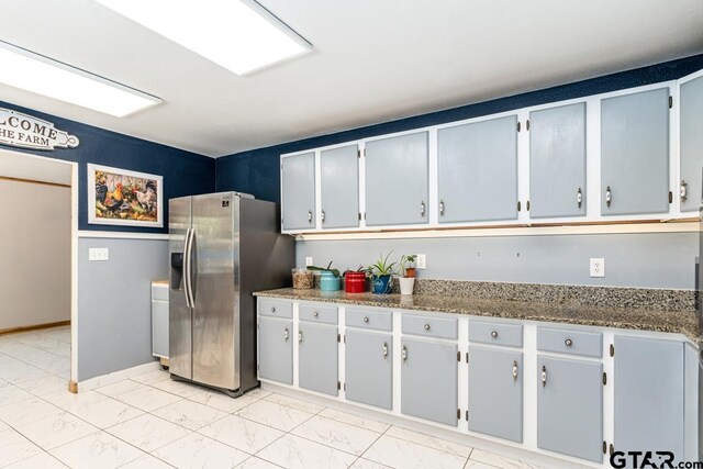 15200 W US Highway 175, Eustace, TX 75124 - kitchen with stainless steel fridge and light marble finish floors