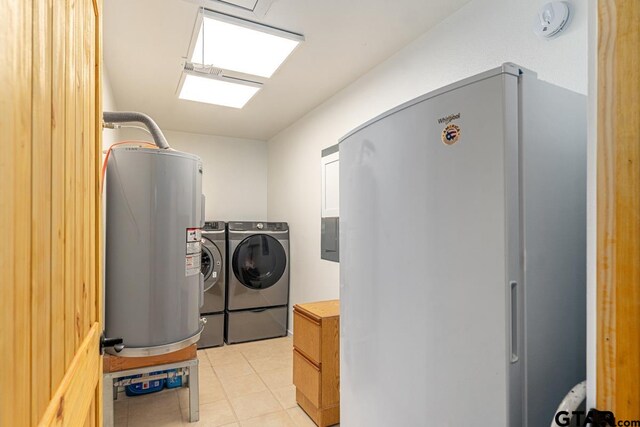15200 W US Highway 175, Eustace, TX 75124 - laundry area featuring water heater, washer and clothes dryer, and light tile patterned floors