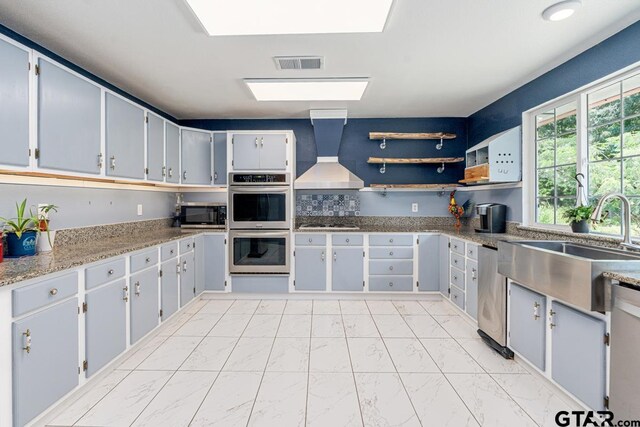 15200 W US Highway 175, Eustace, TX 75124 - kitchen featuring stainless steel appliances, custom exhaust hood, light marble finish flooring, open shelves, and light stone countertops