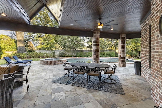 2205 Kingsmill Cir, Tyler, TX 75703 - view of patio with a fenced in pool, outdoor dining space, ceiling fan, an in ground hot tub, and a fenced backyard
