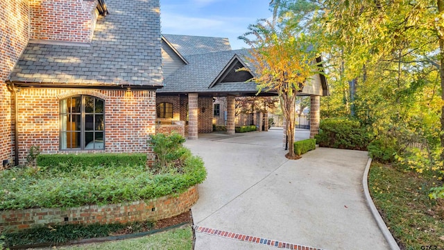 2205 Kingsmill Cir, Tyler, TX 75703 - exterior space with concrete driveway and brick siding