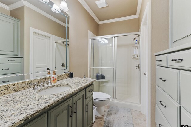 2205 Kingsmill Cir, Tyler, TX 75703 - bathroom with toilet, ornamental molding, a stall shower, vanity, and tile patterned floors
