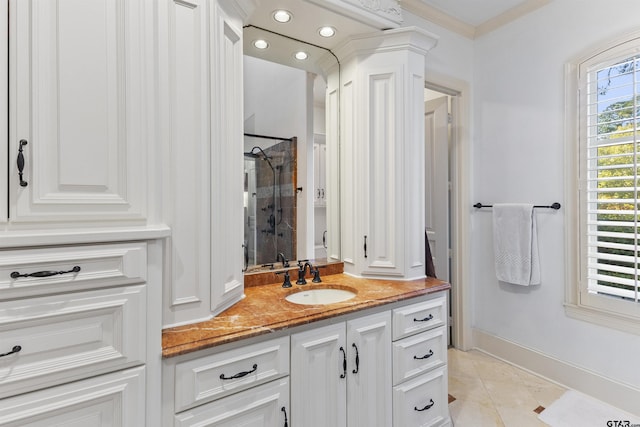 2205 Kingsmill Cir, Tyler, TX 75703 - full bath featuring a stall shower, baseboards, ornamental molding, tile patterned flooring, and vanity