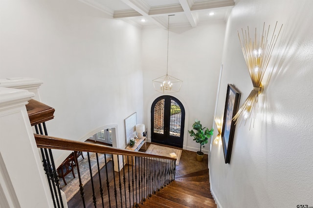 2205 Kingsmill Cir, Tyler, TX 75703 - entrance foyer featuring baseboards, coffered ceiling, an inviting chandelier, french doors, and beam ceiling