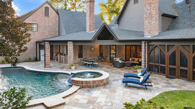 2205 Kingsmill Cir, Tyler, TX 75703 - back of property featuring an outdoor hangout area, brick siding, an outdoor bar, a chimney, and a patio area