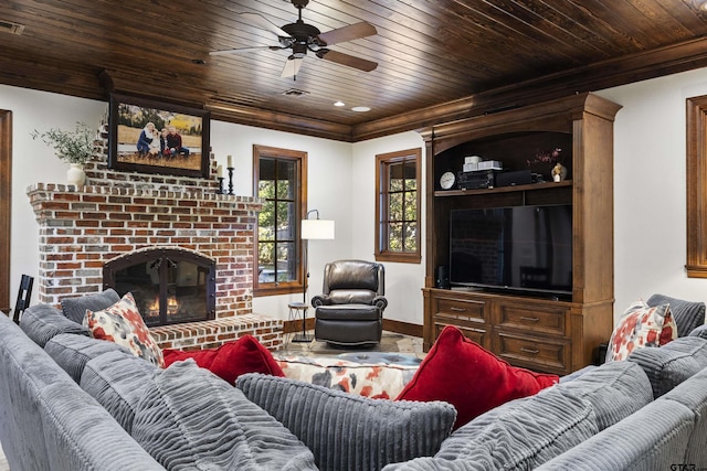 2205 Kingsmill Cir, Tyler, TX 75703 - living area with crown molding, wood ceiling, and a fireplace