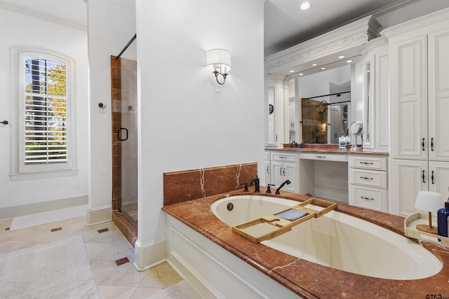 2205 Kingsmill Cir, Tyler, TX 75703 - bathroom with recessed lighting, vanity, baseboards, a bath, and a stall shower