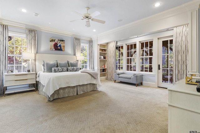 2205 Kingsmill Cir, Tyler, TX 75703 - bedroom featuring access to outside, ornamental molding, multiple windows, and light colored carpet