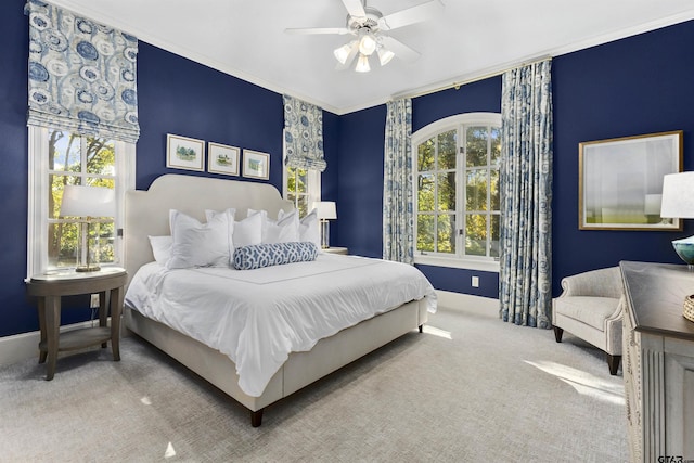 2205 Kingsmill Cir, Tyler, TX 75703 - bedroom with baseboards, multiple windows, ceiling fan, and carpet flooring