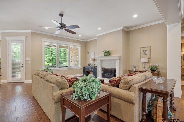 living area with ceiling fan, recessed lighting, wood finished floors, a premium fireplace, and baseboards