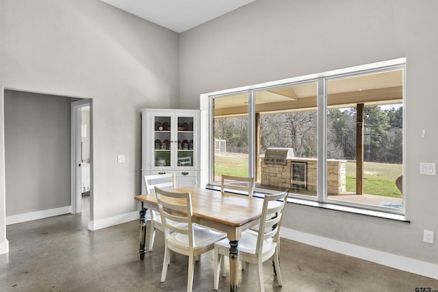 dining space featuring concrete flooring