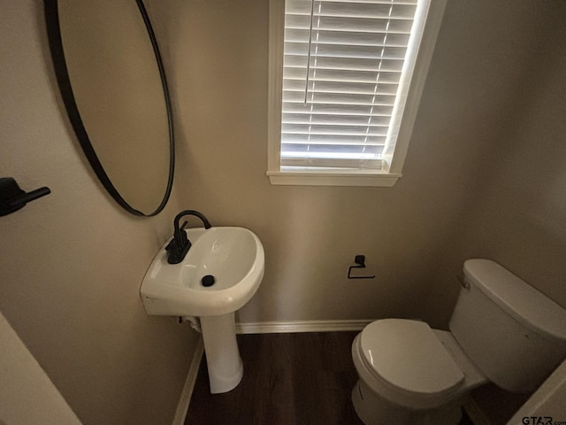 bathroom featuring hardwood / wood-style floors, sink, and toilet