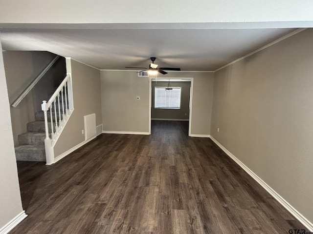 unfurnished living room featuring dark wood-type flooring, ceiling fan, and crown molding