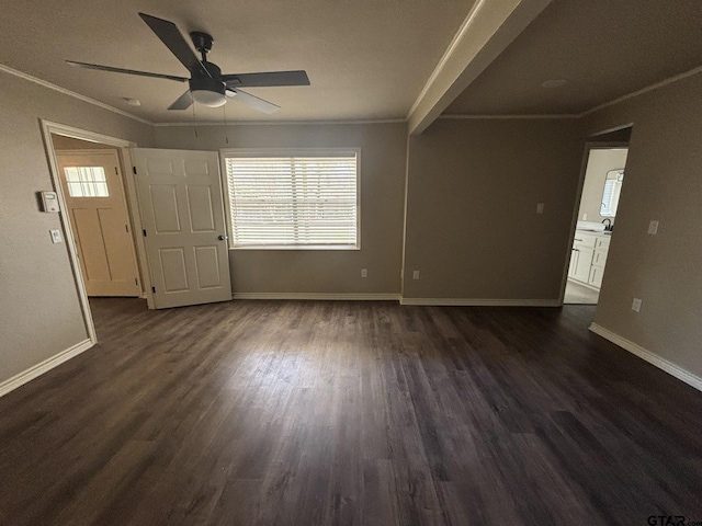 interior space with dark hardwood / wood-style flooring, sink, crown molding, and ceiling fan