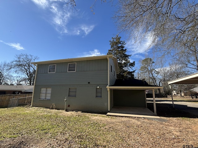 rear view of property with a yard