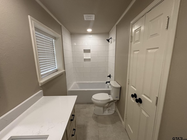 full bathroom with tiled shower / bath combo, vanity, and toilet