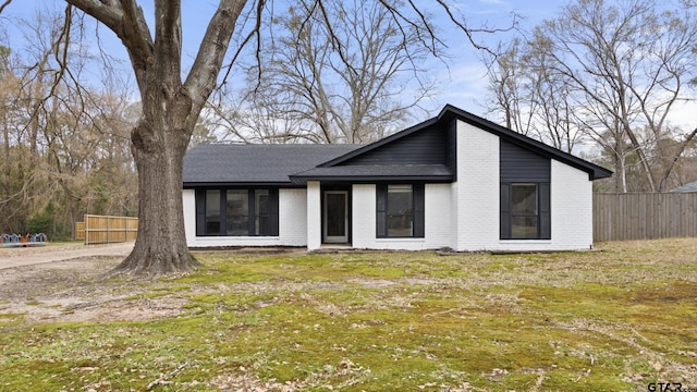 view of front of property with a front lawn