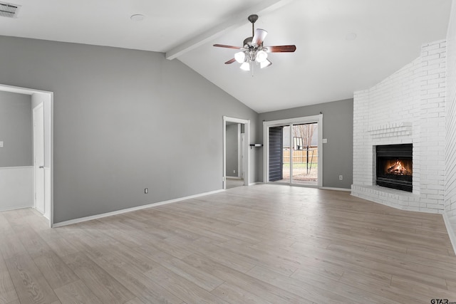 unfurnished living room with a brick fireplace, light hardwood / wood-style flooring, ceiling fan, high vaulted ceiling, and beamed ceiling