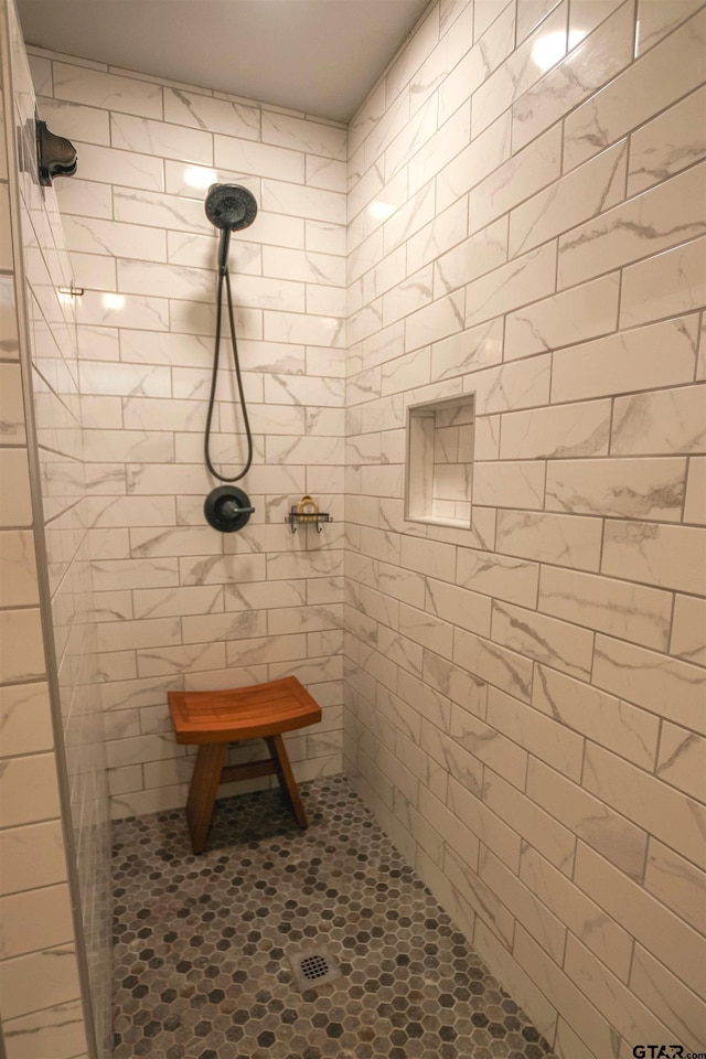 5734 Mustang Trl, Tyler, TX 75707 - bathroom featuring a tile shower and tile patterned flooring