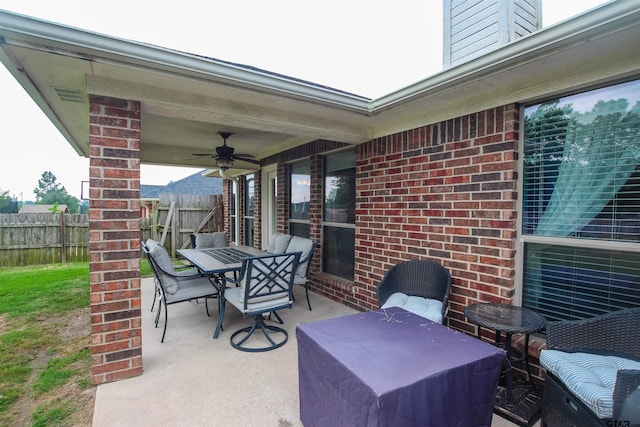 5734 Mustang Trl, Tyler, TX 75707 - view of patio / terrace with outdoor dining area, fence, and ceiling fan
