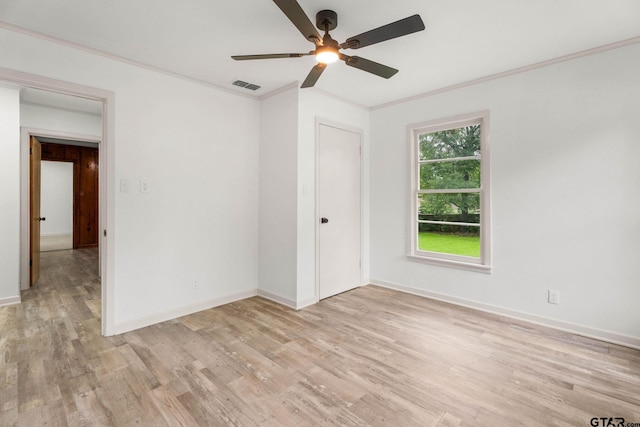 708 E Barbara St, Tyler, TX 75701 - unfurnished room with crown molding, a ceiling fan, and light wood-style floors