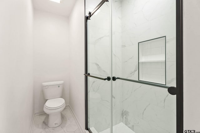 708 E Barbara St, Tyler, TX 75701 - bathroom with a marble finish shower and marble look tile flooring