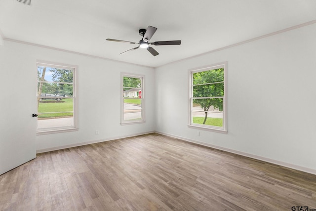 708 E Barbara St, Tyler, TX 75701 - empty room with plenty of natural light, wood finished floors, a ceiling fan, and crown molding
