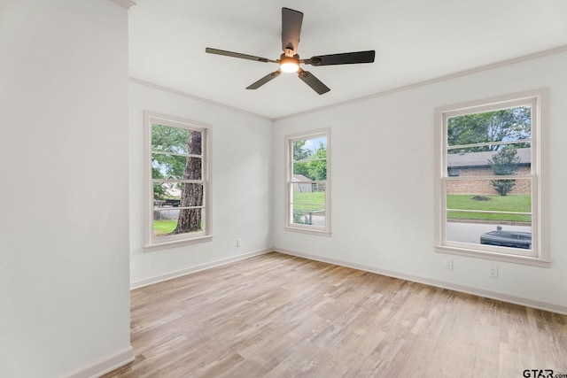 708 E Barbara St, Tyler, TX 75701 - spare room with crown molding, light wood-style floors, ceiling fan, and plenty of natural light
