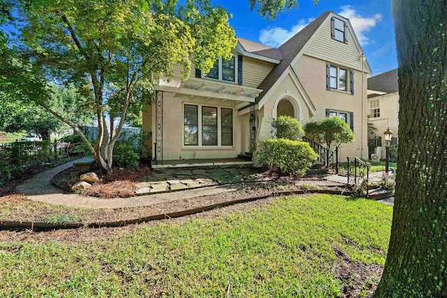 view of front of property with a front lawn