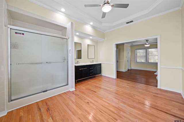 bathroom with ceiling fan, vanity, hardwood / wood-style flooring, and ornamental molding