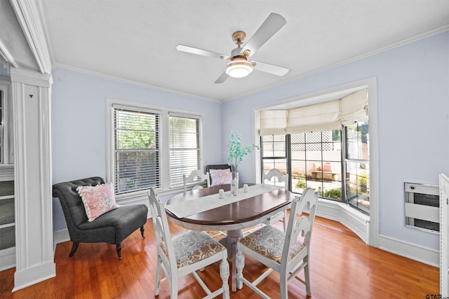 145 Rowland Pl, Tyler, TX 75701 - dining room featuring crown molding, healthy amount of natural light, wood finished floors, and a ceiling fan