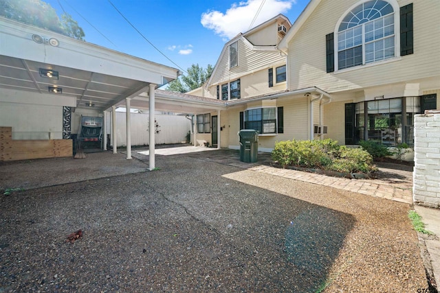 exterior space with a carport