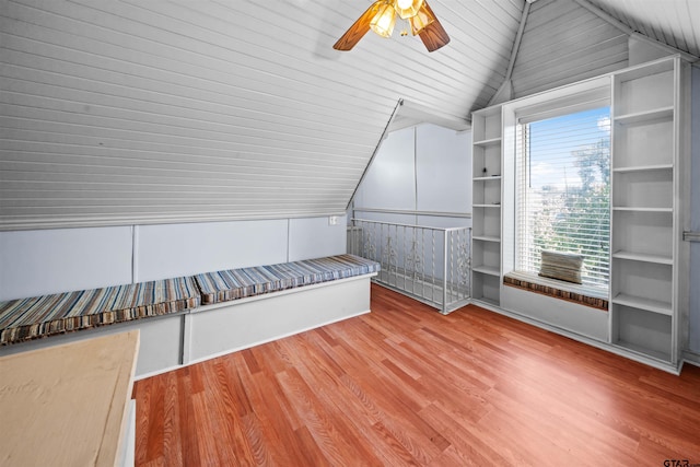 additional living space with ceiling fan, wood-type flooring, wood ceiling, and lofted ceiling